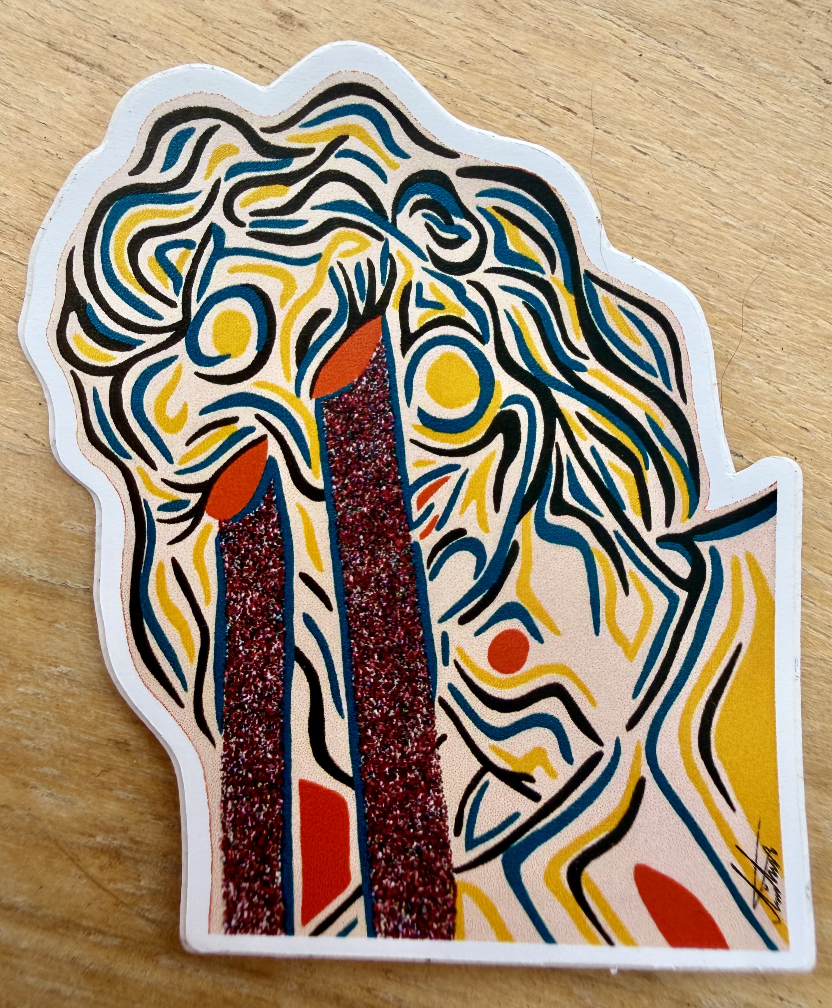 Glitter Tears sticker with expressive black linework, yellow and blue details, and a tear shape.